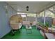 Inviting covered patio with comfortable furniture, string lights, and ample greenery at 759 Cape Cod Cir, Valrico, FL 33594