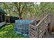 Backyard features a large above-ground pool with wooden deck and safety ladder at 759 Cape Cod Cir, Valrico, FL 33594