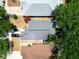 Aerial view of backyard pool with blue tiling surrounded by manicured synthetic grass at 759 Cape Cod Cir, Valrico, FL 33594