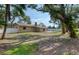 Expansive backyard with privacy fence, large trees, patio, and ample space for outdoor activities at 770 27Th S Ave, St Petersburg, FL 33705