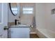 Bright bathroom features granite counters, modern fixtures, and subway tile shower with niche at 770 27Th S Ave, St Petersburg, FL 33705