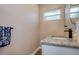Stylish bathroom vanity with granite countertop, modern fixtures, and a framed mirror at 770 27Th S Ave, St Petersburg, FL 33705