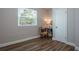 Bedroom featuring wood-look floors, a window with blinds, and a cozy corner setup at 770 27Th S Ave, St Petersburg, FL 33705