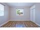 Bedroom featuring hardwood floors, neutral walls, and window with natural light at 770 27Th S Ave, St Petersburg, FL 33705