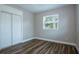 Neutral bedroom with hardwood floors, closet, and one window at 770 27Th S Ave, St Petersburg, FL 33705