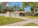 Charming single-story home with a well-manicured lawn and a two-car garage at 770 27Th S Ave, St Petersburg, FL 33705