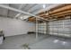 Open garage space with painted walls and ceiling and a traditional garage door at 770 27Th S Ave, St Petersburg, FL 33705
