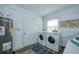 Laundry room includes washer, dryer, and water heater at 770 27Th S Ave, St Petersburg, FL 33705