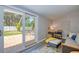 Bright living room with patio access to backyard, comfortable seating, and stylish decor at 770 27Th S Ave, St Petersburg, FL 33705