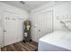 Utility room including a water heater, room for laundry, and vinyl floors at 770 27Th S Ave, St Petersburg, FL 33705