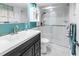 Bright bathroom featuring a glass shower, large countertop, and ample storage at 7801 11Th N St # 104, St Petersburg, FL 33702