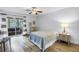 Cozy bedroom with access to a screened lanai at 7801 11Th N St # 104, St Petersburg, FL 33702