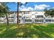 Building exterior shows lush green spaces surrounding the well-maintained apartments at 7801 11Th N St # 104, St Petersburg, FL 33702