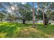 Community grounds provides shady spaces for recreation with lush trees and landscaping at 7801 11Th N St # 104, St Petersburg, FL 33702