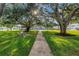 Lush community grounds feature mature trees, walking paths, and inviting green spaces at 7801 11Th N St # 104, St Petersburg, FL 33702