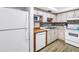 Bright kitchen featuring wood cabinets and modern appliances at 7801 11Th N St # 104, St Petersburg, FL 33702