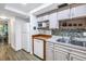 Kitchen featuring white appliances, backsplash and wooden counters at 7801 11Th N St # 104, St Petersburg, FL 33702