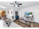 Open-concept living room with modern furniture, sleek TV console, and a cozy atmosphere at 7801 11Th N St # 104, St Petersburg, FL 33702