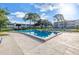 Inviting community pool with ample lounge seating, perfect for relaxation and recreation at 7801 11Th N St # 104, St Petersburg, FL 33702