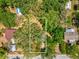 Aerial view of the treed lot in a neighborhood. Close to highway, shops, restaurants and more at 7813 Cadillac Ave, Hudson, FL 34667