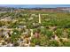 Picturesque aerial view of the property location near water and lush surroundings at 7813 Cadillac Ave, Hudson, FL 34667