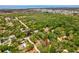 Discover a property nestled in nature, featuring lush trees and access to the bay at 7813 Cadillac Ave, Hudson, FL 34667