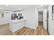 Modern kitchen featuring a quartz counter peninsula and stainless steel appliances at 7813 Cadillac Ave, Hudson, FL 34667
