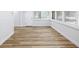 Light-filled room with vinyl flooring and ample natural light from the windows at 7813 Cadillac Ave, Hudson, FL 34667