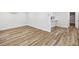 Spacious room featuring durable vinyl flooring and freshly painted walls at 7813 Cadillac Ave, Hudson, FL 34667