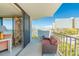 Balcony with comfortable seating offering stunning views of the water and city skyline at 80 Rogers St # 6D, Clearwater, FL 33756