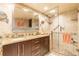 Updated bathroom with double sinks, granite counters, and a glass shower at 80 Rogers St # 6D, Clearwater, FL 33756