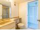 Bathroom featuring a vanity, toilet, and closet at 80 Rogers St # 6D, Clearwater, FL 33756