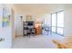 Bright bedroom featuring two desk areas and large windows with views at 80 Rogers St # 6D, Clearwater, FL 33756