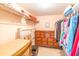 Walk in closet with shelving, hanging storage, and a dresser at 80 Rogers St # 6D, Clearwater, FL 33756