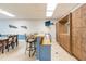 Community room with a bar, lockers, and dining area, ideal for social gatherings and events at 80 Rogers St # 6D, Clearwater, FL 33756