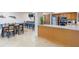 Community kitchen and dining area with a breakfast bar and full appliances, perfect for gatherings and meals at 80 Rogers St # 6D, Clearwater, FL 33756