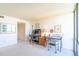 Bright living room with desks, chairs, and large windows at 80 Rogers St # 6D, Clearwater, FL 33756