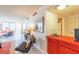 Living room area features tiled flooring, comfortable seating, and a wet bar area at 80 Rogers St # 6D, Clearwater, FL 33756