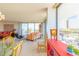 Inviting living room featuring stylish furniture, large windows and a balcony with water view at 80 Rogers St # 6D, Clearwater, FL 33756