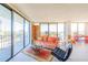 Bright living room with city views, large windows, and stylish contemporary furnishings at 80 Rogers St # 6D, Clearwater, FL 33756