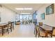 Bright lobby area features seating and views of palm trees through the large windows at 80 Rogers St # 6D, Clearwater, FL 33756