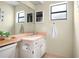 Bathroom features a vanity with a mirror and overhead lighting at 8246 Westfield Dr, Port Richey, FL 34668