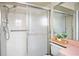 Shower featuring glass doors, a handheld shower head and grab bar at 8246 Westfield Dr, Port Richey, FL 34668