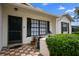 Inviting front door with tiled entryway and manicured landscaping for added curb appeal at 8246 Westfield Dr, Port Richey, FL 34668