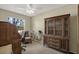 Well-lit bedroom featuring a charming desk, unique bicycle decor, and a classic wooden cabinet at 8737 Beaver Ln, Port Richey, FL 34668
