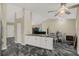 Open floor plan featuring dining area, stone fireplace, and stylish flooring at 8737 Beaver Ln, Port Richey, FL 34668