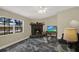Inviting living room area with stone fireplace, a large window, and comfortable seating at 8737 Beaver Ln, Port Richey, FL 34668
