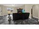 Comfortable living space featuring stone fireplace, and unique flooring at 8737 Beaver Ln, Port Richey, FL 34668