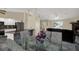 An open floorplan living area with modern kitchen with granite counter tops at 8737 Beaver Ln, Port Richey, FL 34668