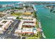 Aerial view featuring the condos, boat docks and tennis courts at 8931 Blind Pass Rd # 262, St Pete Beach, FL 33706
